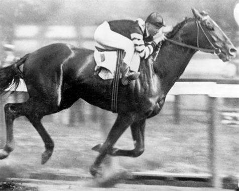 The great Man O' War romping down the home stretch in the 1920 Belmont Stakes.